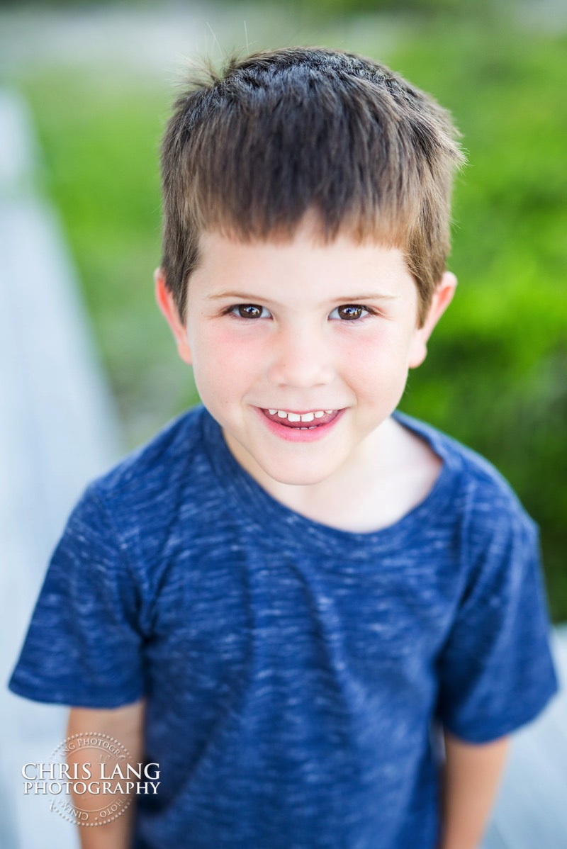 small boy smiling for camera - Places for family vacation - Bald Head Island Photographers - BHI Photography - Kids Portraits -  Pictures on Bald Head Island - BHI Photo Services - Chris Lang Photography 