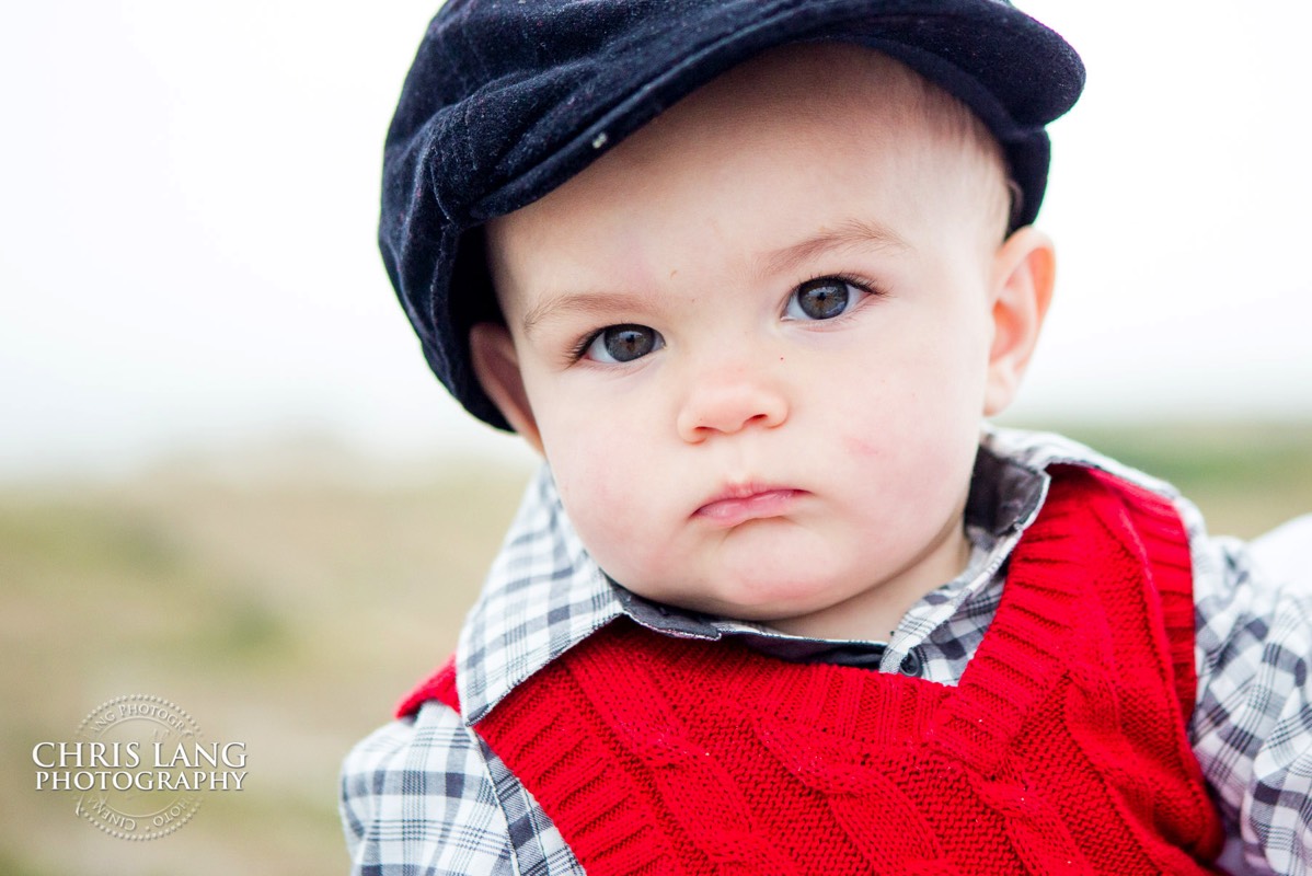 Toddler in blue hat and red vest - Places for family vacation - Bald Head Island Photographers - BHI Photography - North Carolina- Kids Portraits -  Pictures on Bald Head Island - BHI Photo Services - Chris Lang Photography 