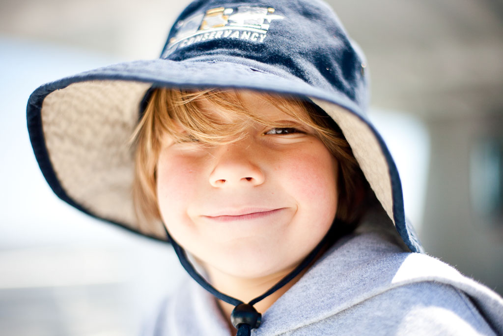 Bald Head-Island North Carolina Photography-Photographers-Beach picture with young boy in Bald Head Island  hat
