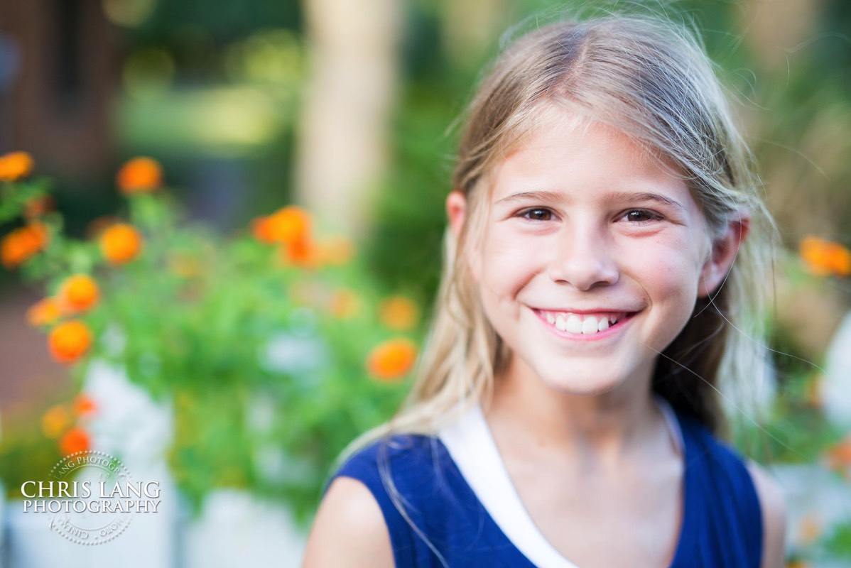 young girl smiling for picture - Places for family vacation - Bald Head Island Photographers - BHI Photography - Kids Portraits -  Pictures on Bald Head Island - BHI Photo Services - Chris Lang Photography 