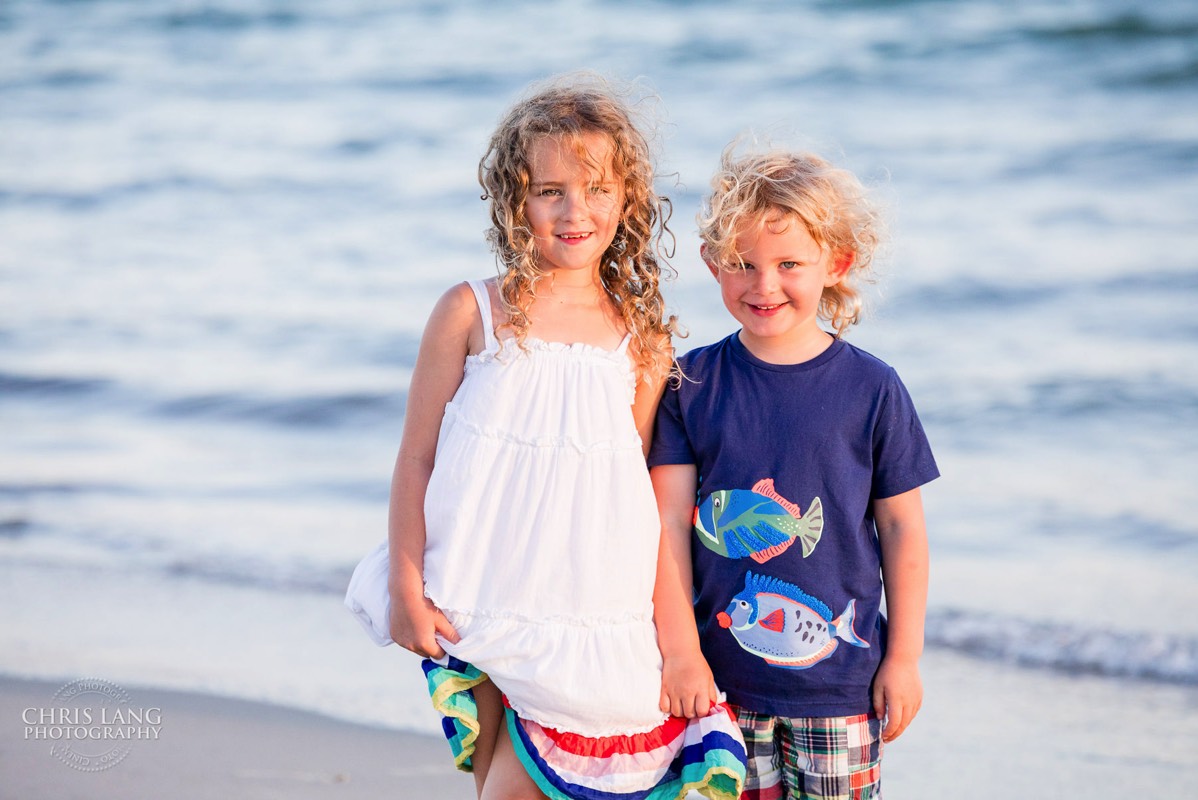 brother and sister pose for picture  at the beach - Places for family vacation - Bald Head Island Photographers - BHI Photography - Kids Portraits -  Pictures on Bald Head Island - BHI Photo Services - Chris Lang Photography 