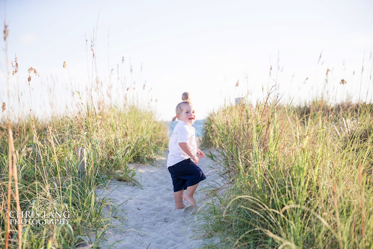 young boy walking to the beach - Places for family vacation - Bald Head Island Photographers - BHI Photography - Kids Portraits -  Pictures on Bald Head Island - BHI Photo Services - Chris Lang Photography 