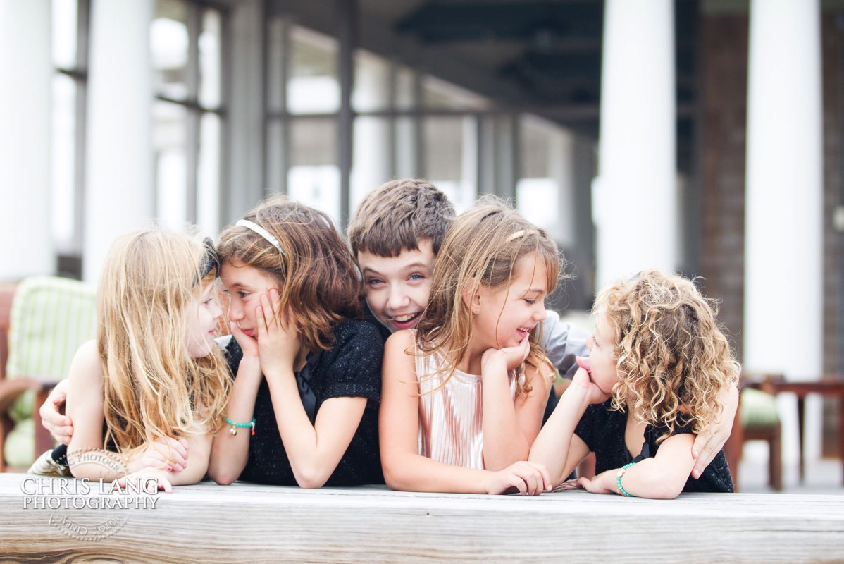 candid image of littttle kids having fun while taking a picture - family vacation -  Bald Head Island Photographers - BHI Photography - Kids Portraits -  Pictures on Bald Head Island - BHI Photo Services - Chris Lang Photography 