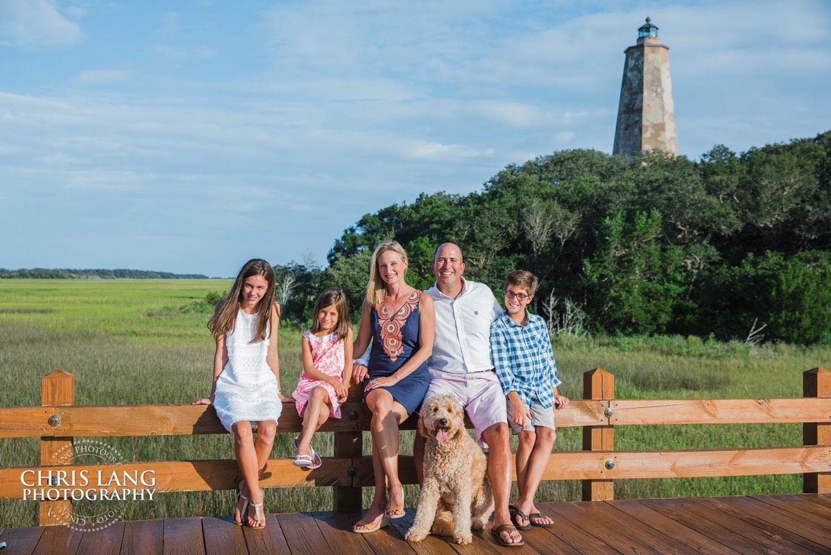family picture at Old Baldy lighthouse - Pictures on Bald Head Island - family dog - Bald Head Island Photographers - BHI Family Photography - Family Photos  - family portrait   family pictures  - BHI Photographer  - Bald Head Island pictures - Chris Lang Photography 