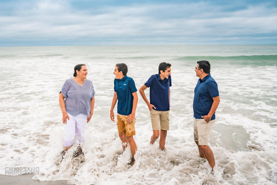 Family plaing in the water at the beach   -Topsail Island Photography - Topsail Island NC Photographers - Chris Lang Photography -  Beach Photography - Family Photographer - Family photo - Beach Photographer - Beach Portraits -  Coastal Lifestyle Photography