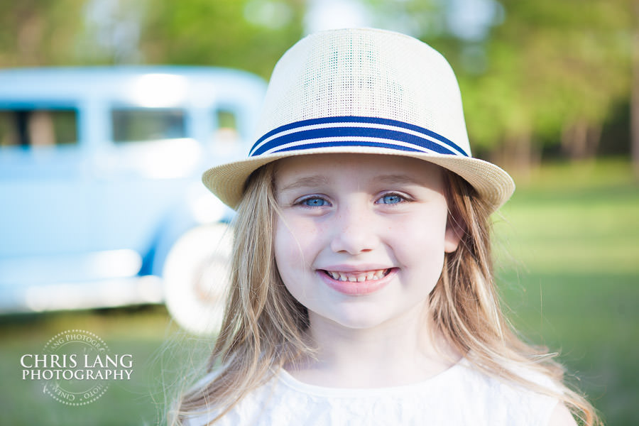 child portrait - hat - girl - smiling - Wilmington  NC Family Photographers - Family Photography Service - Family Picture - Family Portraits