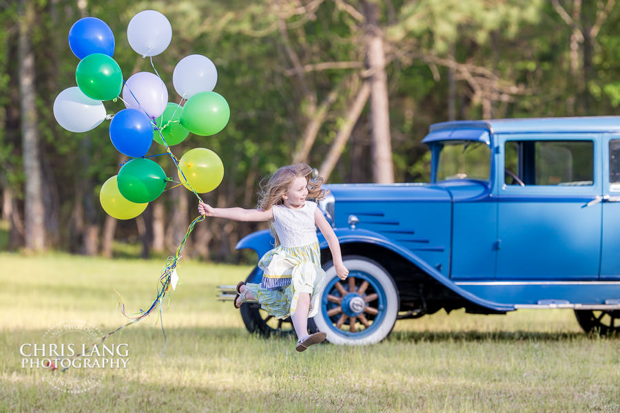 Little girl running with balloons - Wilmington  NC Family Photographers - Family Photography Service - Family Picture - Family Portraits