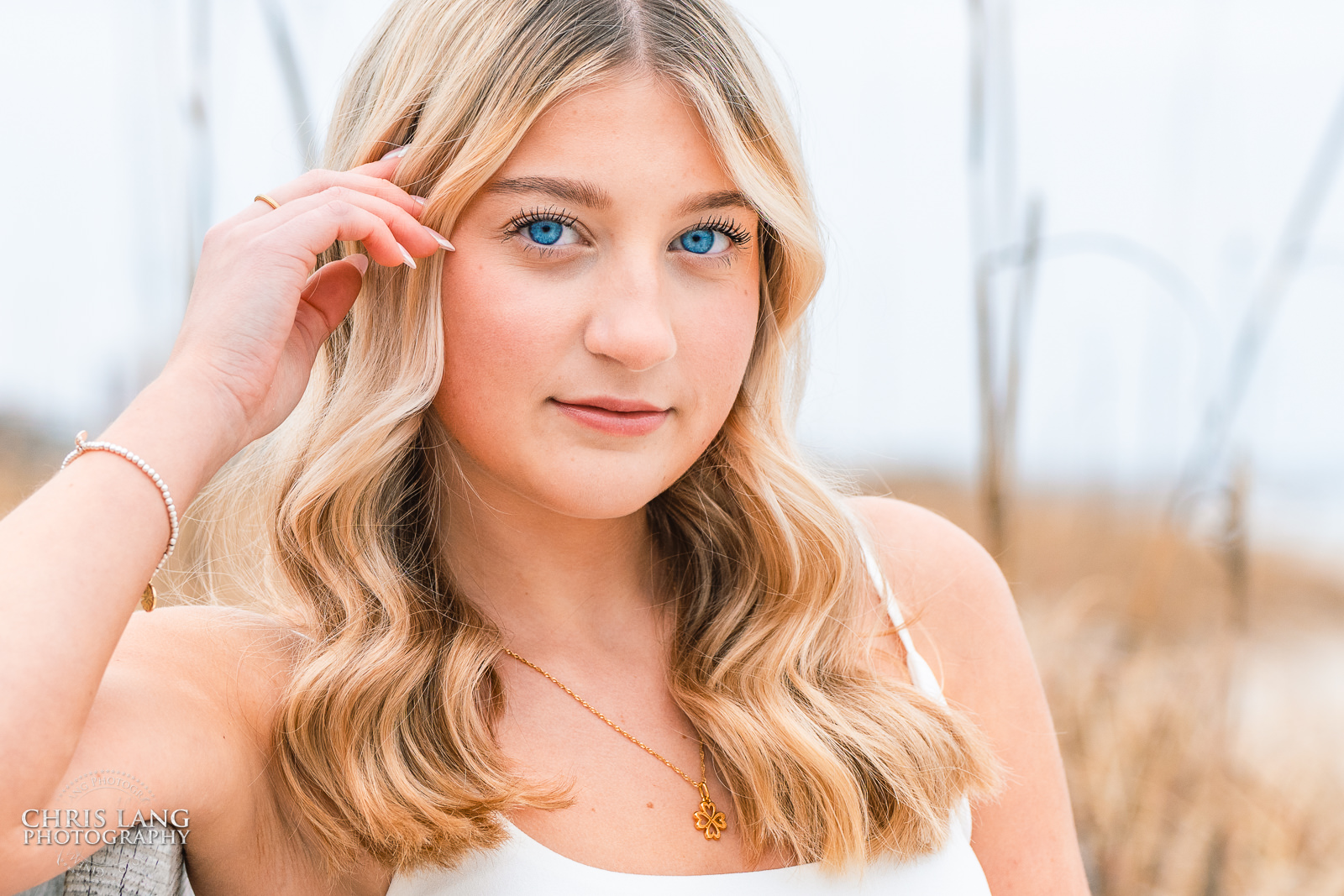 Image of High schoole senior on the beach at the Oceanic - Wrightsville Beach High School Senior Photography - Wrightsville Beach Photographers - Beach Senior Portrait  Photos- Chris Lang Photography  