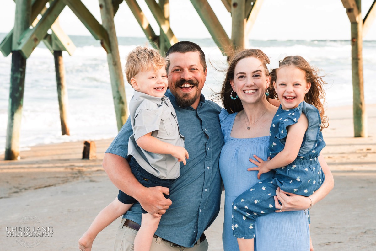 Image of family smiling for group portrait - The Oceanic - Wrightsville Beach Family Photography - Wrightsville Beach Photographers - Beach Family Photos- Chris Lang Photography  
