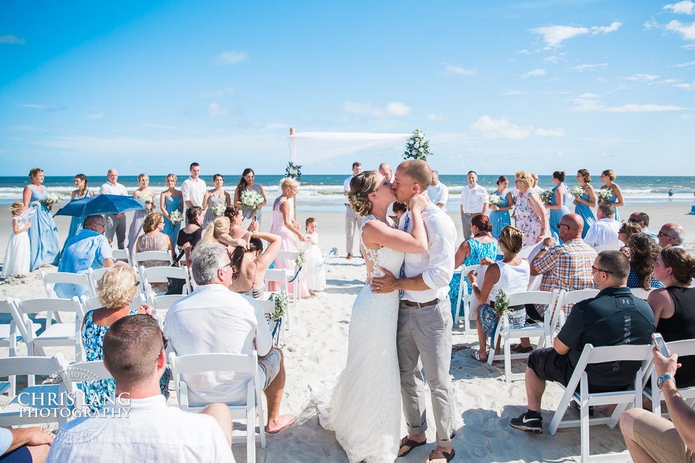 image of beach wedding ceremony - beach weddings - beach wedding picture - wedding ideas - beach wedding photography - Wrightstville Beach - Chris Lang Photography