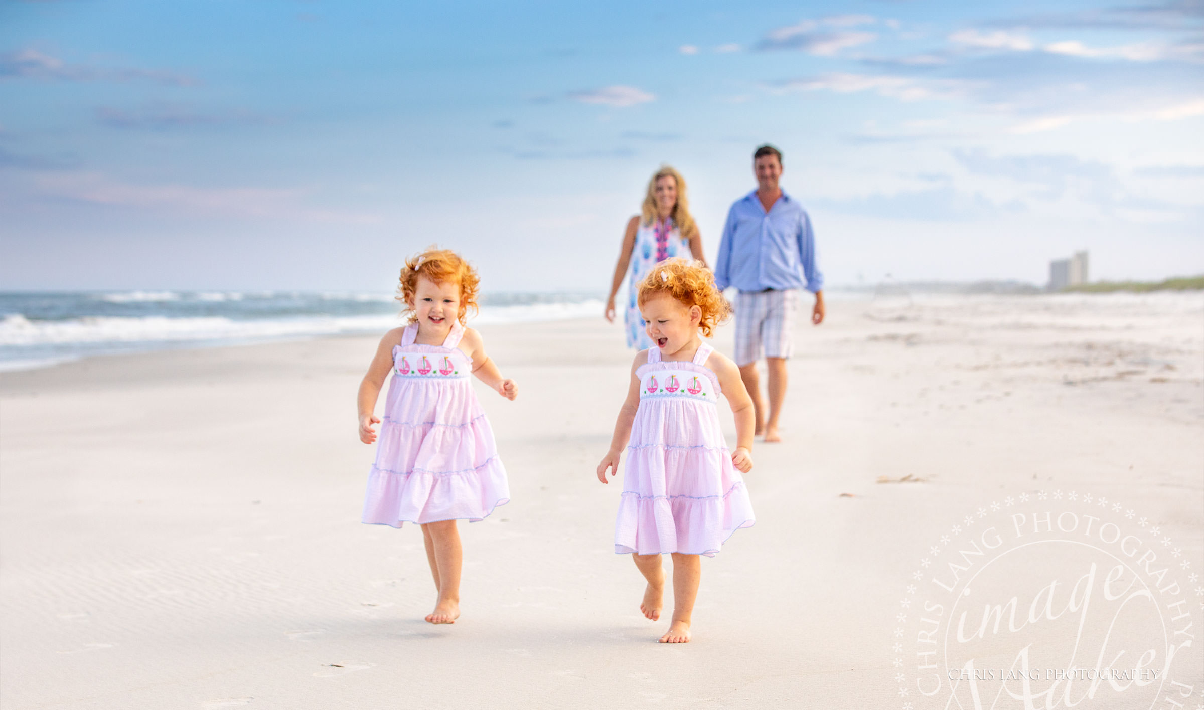 Two little girls in pink dresses on the beach - Figure Eight Island Photography - Photographers - Figure 8 Island  - Photography Services - Chris Lang Photography - 