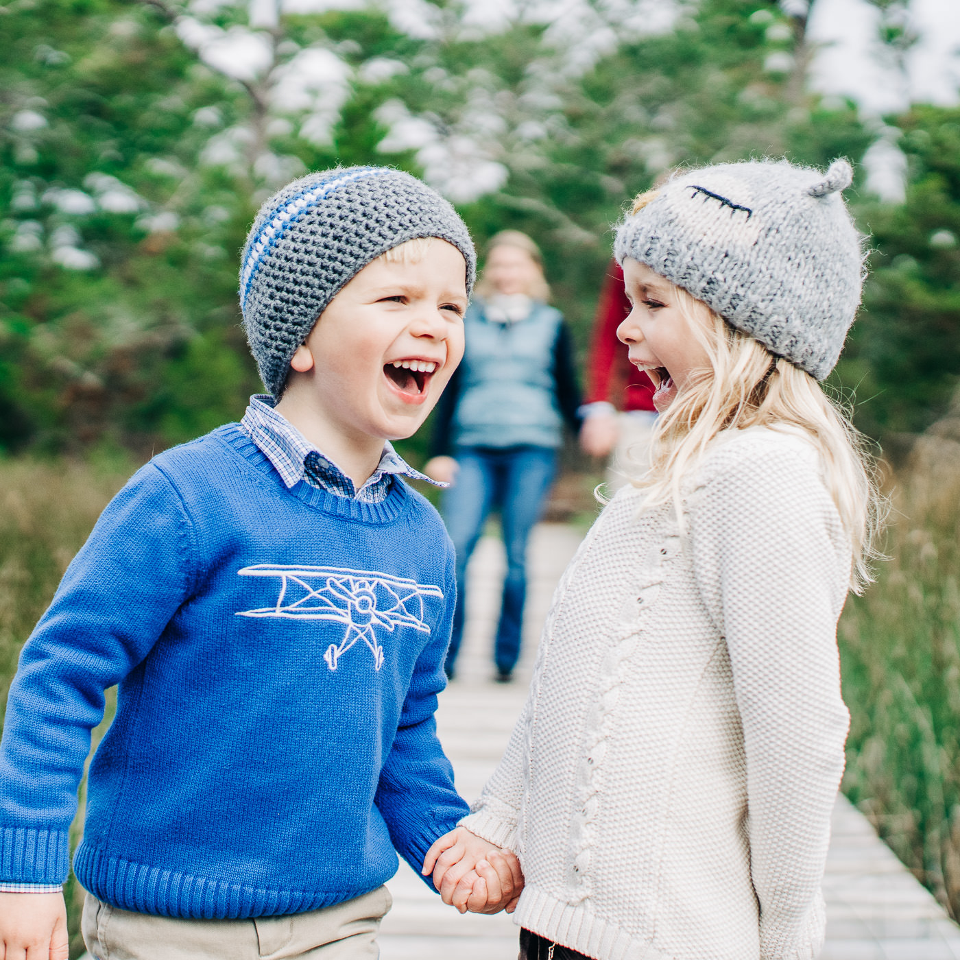 Two kids laughing - lifestyle phootgraphy - amily portrait photography - wilmington nc family portrait photpgraphers - image of family on beach - sunset family picture -  chris lang photography