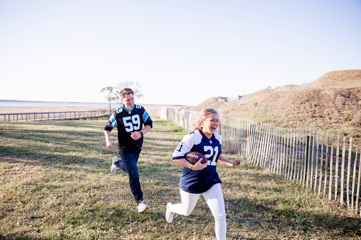 Couple playing football - Fort Fisher North Carolina -  Engagement Photography - Popular engagement photography locations - Lifestyle engagement photography -  Ft Fisher engagement photographers - Engagement session ideas - Trends in engagement photography - Chris Lang Photography - Engagement photos 
