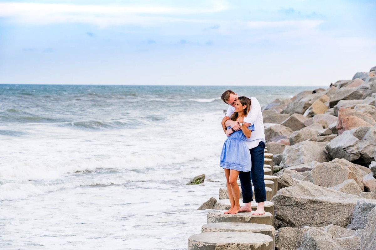 Ocean - sea rocks - Couple photo - Fort Fisher North Carolina -  Engagement Photography - Wedding Ideas - Popular engagement photography locations - Lifestyle engagement photo -  Ft Fisher engagement photographers - Engagement session ideas - New trends in engagement photography - Chris Lang Photography
