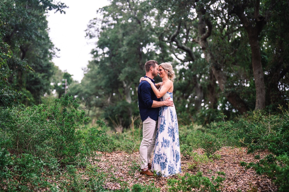 Engagement photo in the trees at Fort Fisher North Carolina -  Engagement Photography - Wedding Ideas - Popular engagement photography locations - Lifestyle engagement photo -  Ft Fisher engagement photographers - Engagement session ideas - New trends in engagement photography - Chris Lang Photography