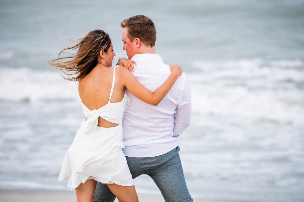 couple at the beach atFort Fisher North Carolina -  Engagement Photography - Wedding Ideas - Popular engagement location - Lifestyle engagement photo -  Ft Fisher engagement photographers - Engagement session ideas - Chris Lang Photography
