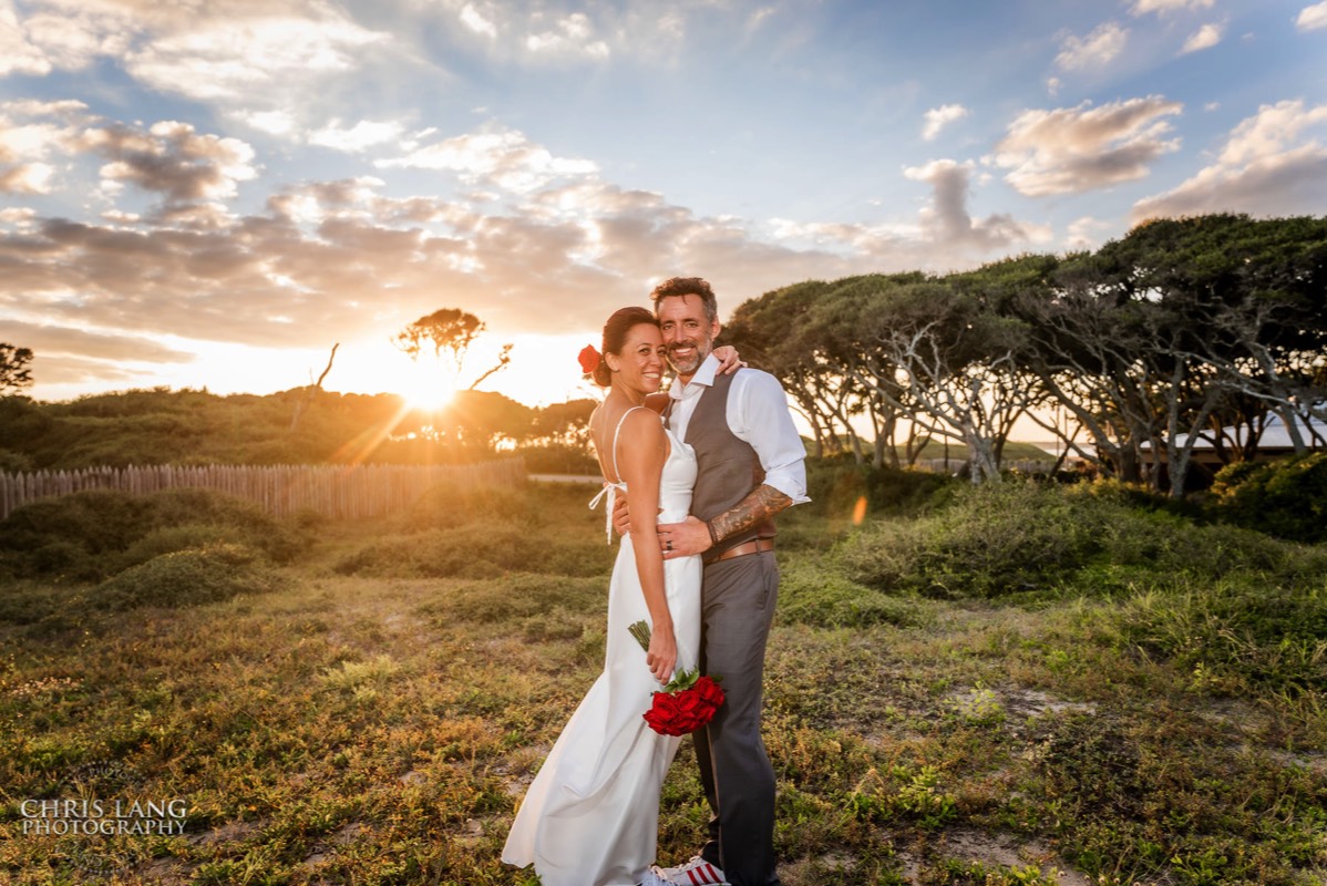 Bride and grom sunset photo - Fort Fisher Wedding Photography - Wedding Photo - Wedding Ideas - Bride - Groom - Wedding Dress - Chris Lang Photography- Popular wedding location 