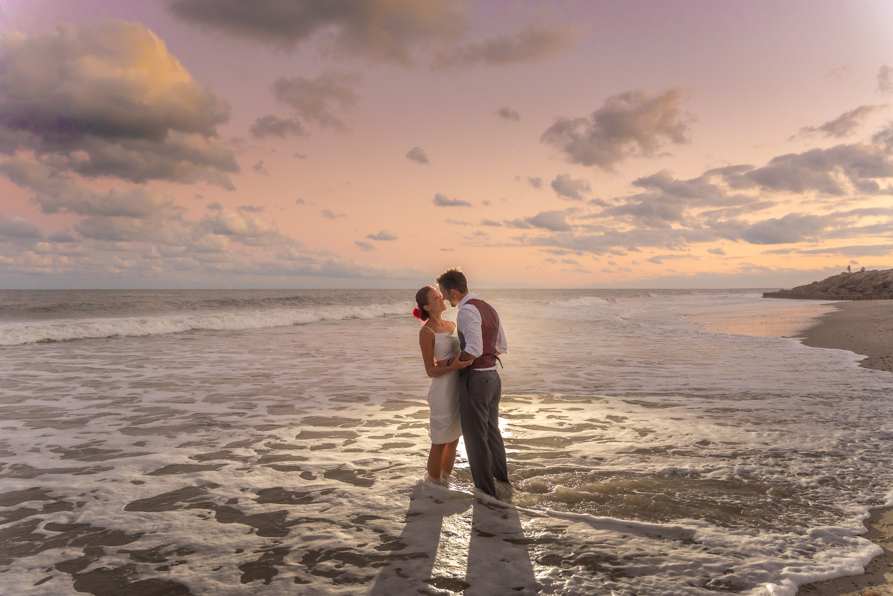 weding- fort fisher nc wedding photograpahers - chris lang photography - bride and groom in the beach waves at Ft Fisher