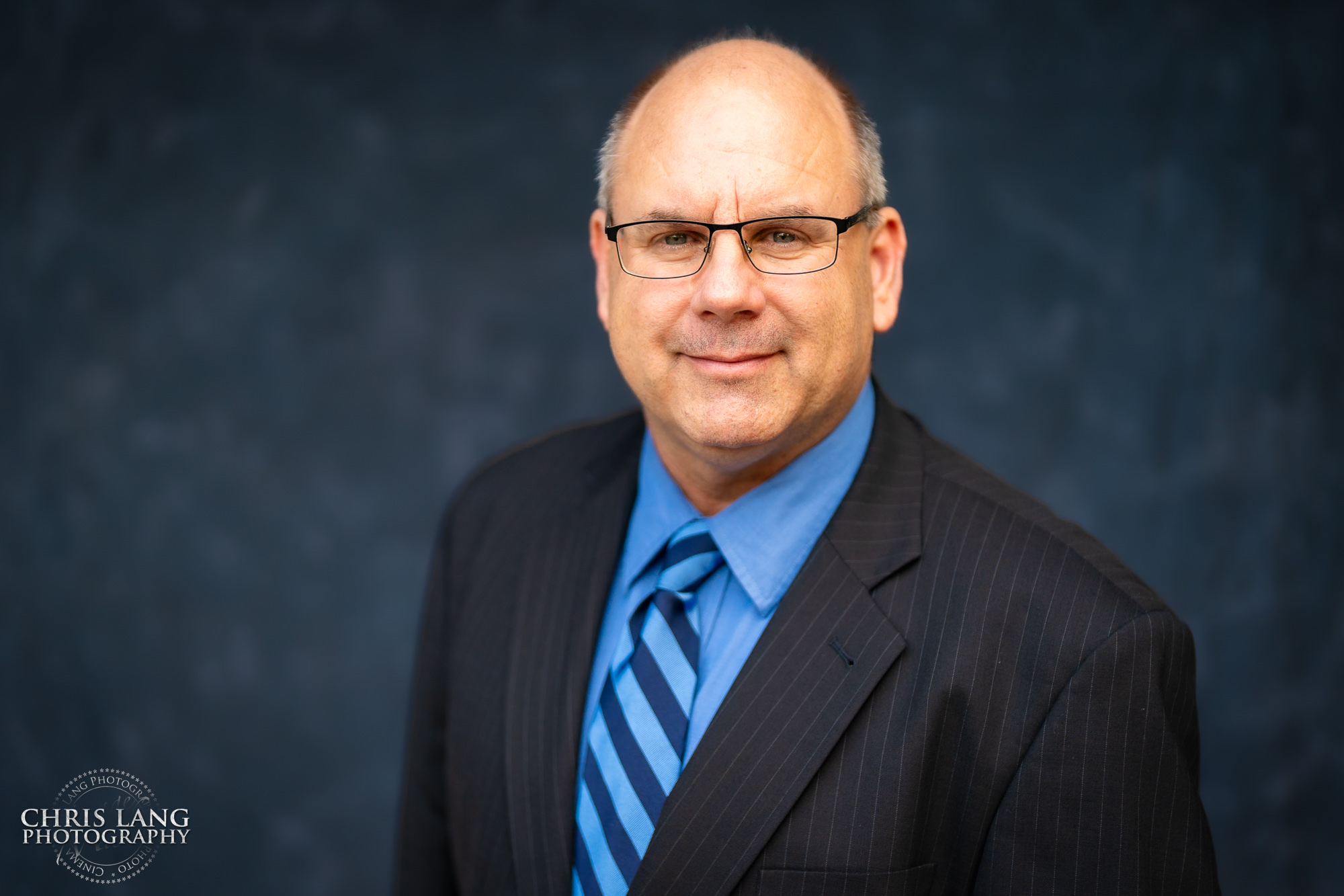 Corporaate headshot for businessman in suit and tie - Studio stlye headshot - - Wilmingotn NC headshot photographers - Chris Lang Photography - Executive portrait