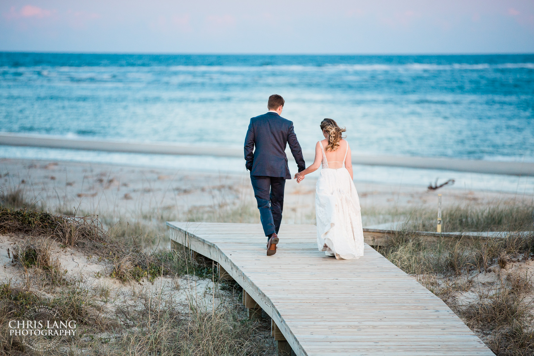 Bride * groom Waling on beach - Shoals CLub - Bald Head Island - Beach Wedding Photography, Beach Wedding Photographers - Beach Wedding Ideas - Chris Lang Photography
