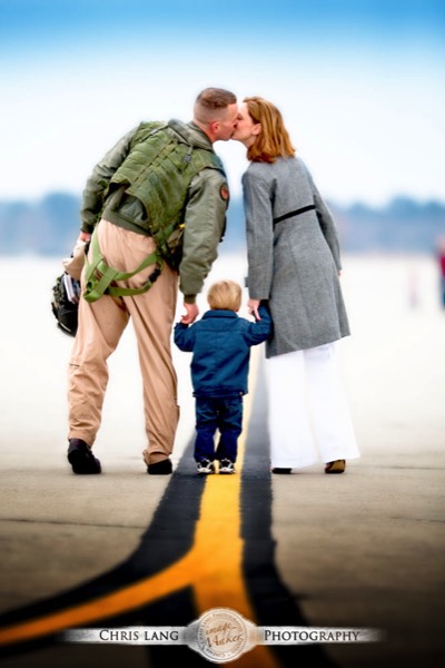 Picture of Pilot meeting his family coming home from deployment
