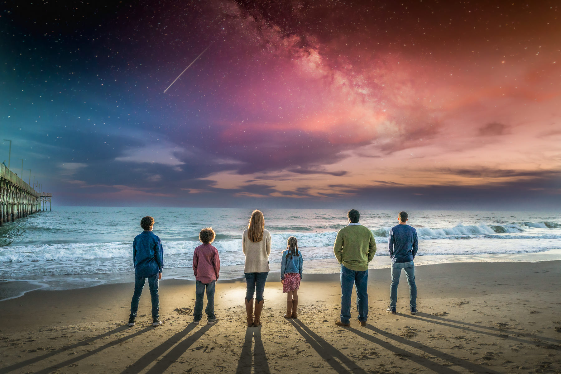 Topsail Island Photographers - Photography - image of family watching the sunset  over the Atlantic ocena on Topsail Island  - Chris Lang Photography - Beach family session - Photo of Topsail Island 