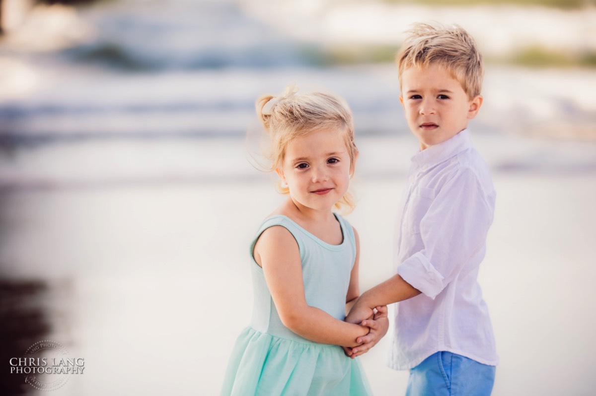  little brother and sister holding hands on the beach  -Topsail Island Photography - Topsail Island NC Photographers - Chris Lang Photography -  Beach Photography - Family Photographer - Family photo - Beach Photographer - Beach Portraits -  Coastal Lifestyle Photography