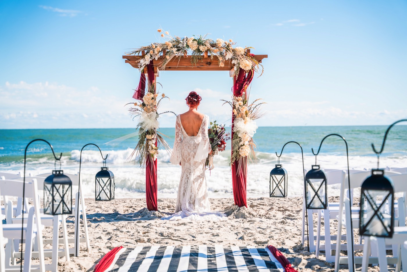 Topsail Island Wedding Photographer - Bride on the beach in her wedding dress - Beach wedding alter - Chris Lang Photography