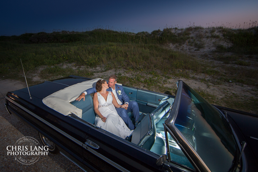 Wedding couple in covertable car on Topsail Island NC - Topsail Island Wedding Photographers