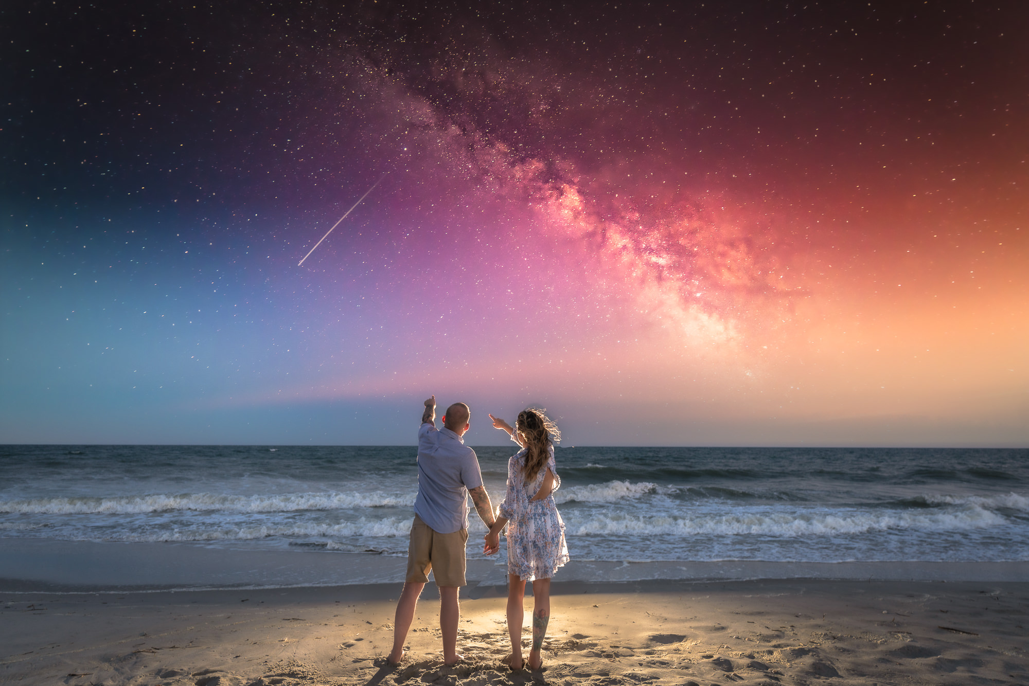 Engagment photo  wrightsville beach - couple  holding hand looking at a twilight sky - - Engagement Photography -  Engagement Photographers - Wilmingrton - NC - Chfris Lang Photography - Engageent photography ideas 